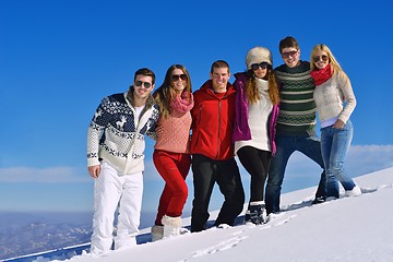 Image showing friends have fun at winter on fresh snow