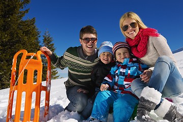 Image showing family having fun on fresh snow at winter vacation