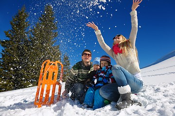 Image showing family having fun on fresh snow at winter vacation