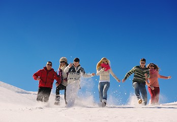 Image showing friends have fun at winter on fresh snow