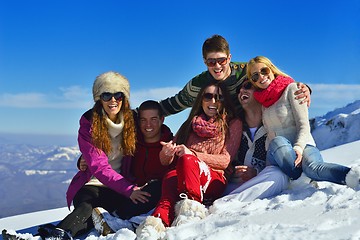 Image showing friends have fun at winter on fresh snow