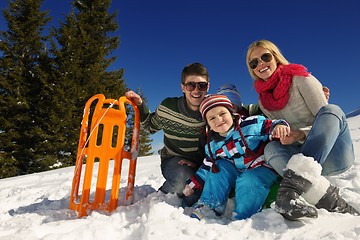 Image showing family having fun on fresh snow at winter vacation