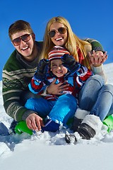 Image showing family having fun on fresh snow at winter vacation