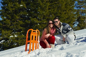 Image showing family having fun on fresh snow at winter vacation