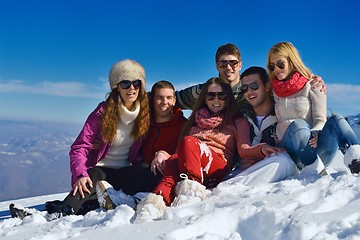 Image showing friends have fun at winter on fresh snow