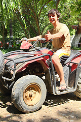 Image showing happy asian boy on quad bike atv