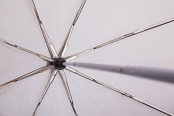 Image showing Close-up of an old grey umbrella