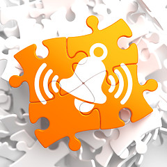 Image showing Ringing White Bell Icon on Orange Puzzle.