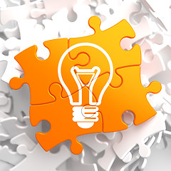 Image showing Light Bulb Icon on Orange Puzzle.
