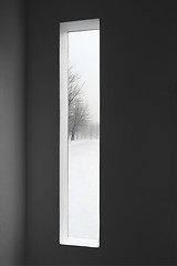 Image showing Dark room and winter landscape outside the window