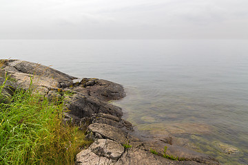 Image showing Rocky coast of a calm sea