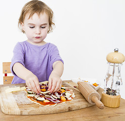 Image showing little girl making fresh pizza