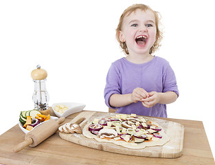 Image showing laughing child with home made pizza