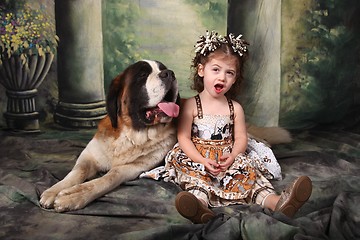 Image showing Adorable Child and Her Saint Bernard Puppy Dog