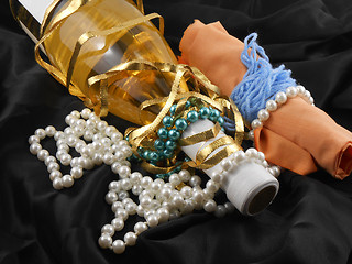 Image showing bottle of champagne wine with white diamonds on black material background