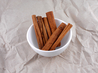 Image showing Cinnamon stick set on old retro paper
