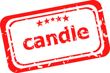 Image showing candle on red rubber stamp over a white background