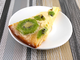 Image showing kiwi tasty cake close up at plate