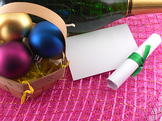 Image showing new year greeting card, champagne bottle and christmas balls