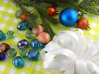 Image showing Christmas decoration with stones flowers and christmas baubles