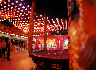 Image showing burning joss stick in a chinese temple