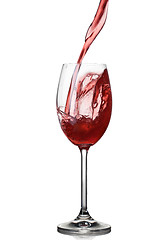 Image showing Splash of wine in glass isolated on white