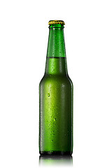 Image showing Beer bottle with water drops isolated on white