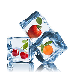 Image showing fruits in ice cubes isolated on white