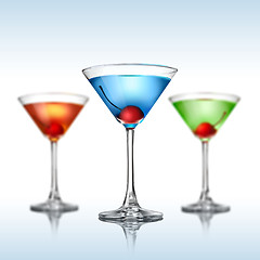 Image showing Different martini color cocktails on white