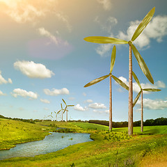 Image showing Green energy concept - natural wind generator turbines on summer