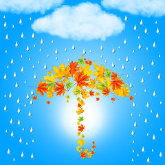 Image showing umbrella from autumn leaves under cloud and rain