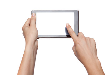 Image showing hands holding and touching tablet isolated on white
