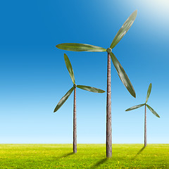 Image showing Green energy concept - natural wind generator turbines on summer