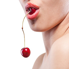 Image showing Young woman with cherry isolated on white