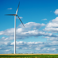 Image showing Wind generator turbine on summer landscape