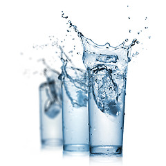 Image showing water splash in glasses isolated on white