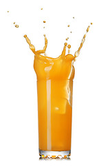 Image showing orange juice splash in the glass isolated on white