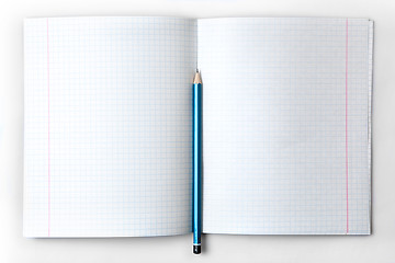 Image showing open empty notebook with lined pages and pencil