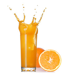 Image showing splash of juice in the glass with orange isolated on white