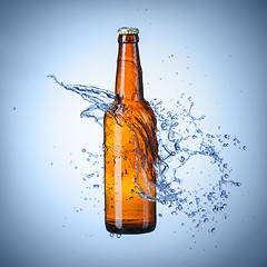 Image showing Beer bottle with water splash