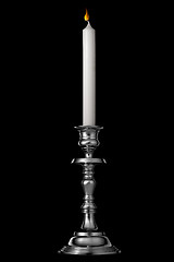 Image showing Silver candlestick with candle isolated on black