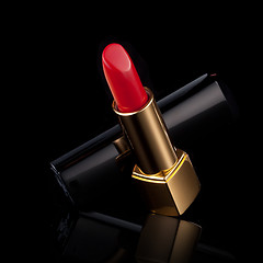 Image showing red lipstick isolated on black