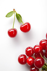 Image showing Red cherry with leaves on white