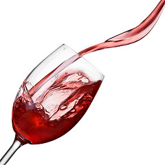 Image showing Splash of wine in glass isolated on white