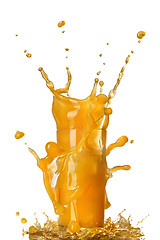 Image showing orange juice splash in the glass isolated on white