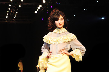 Image showing Asian model on the catwalk during a fashion show - EDITORIAL ONL