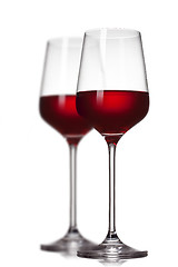 Image showing Two red wine glasses isolated on white