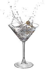 Image showing Martini with splash and olive isolated on white