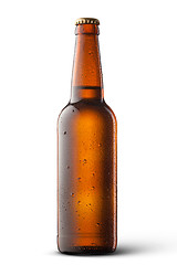 Image showing Beer bottle with water drops isolated on white