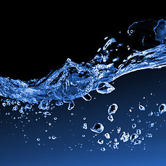 Image showing water splash with bubbles isolated on black